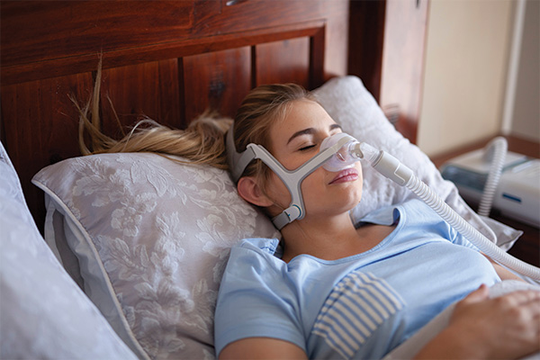 cancer-answer-woman-sleeping-with-cpap-machine